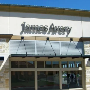 3D letters installed with stand offs on the exterior wall of a building.